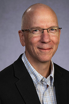 headshot of burton